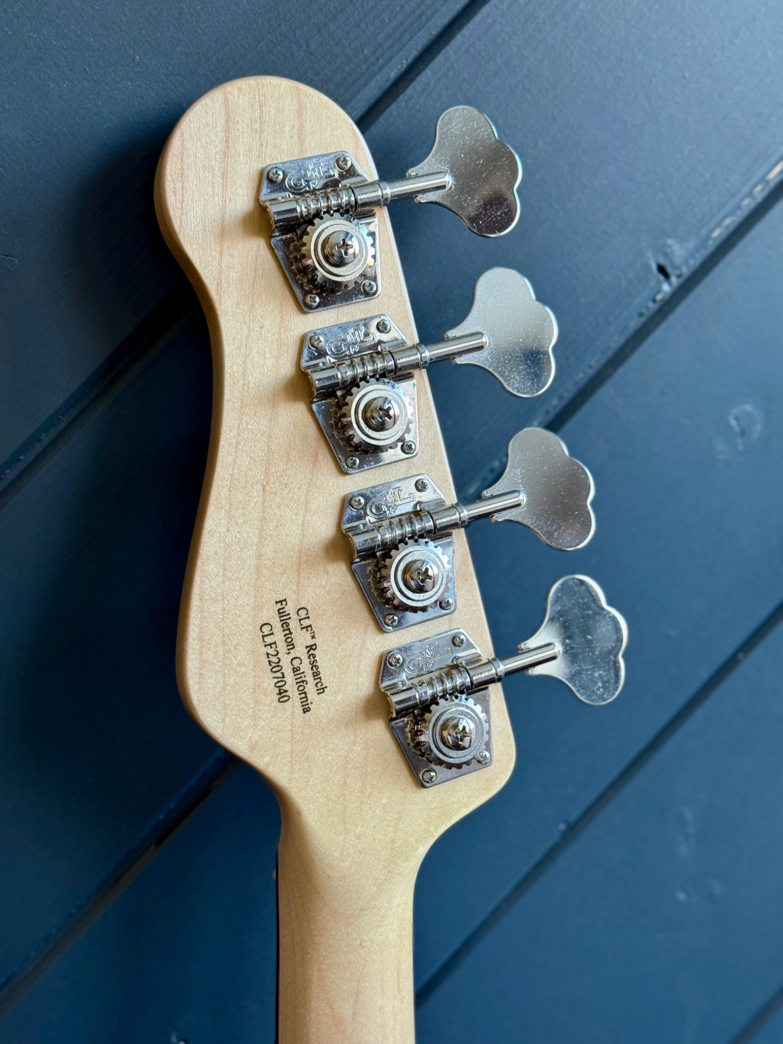 Back of the headstock, including its maker and serial markings.