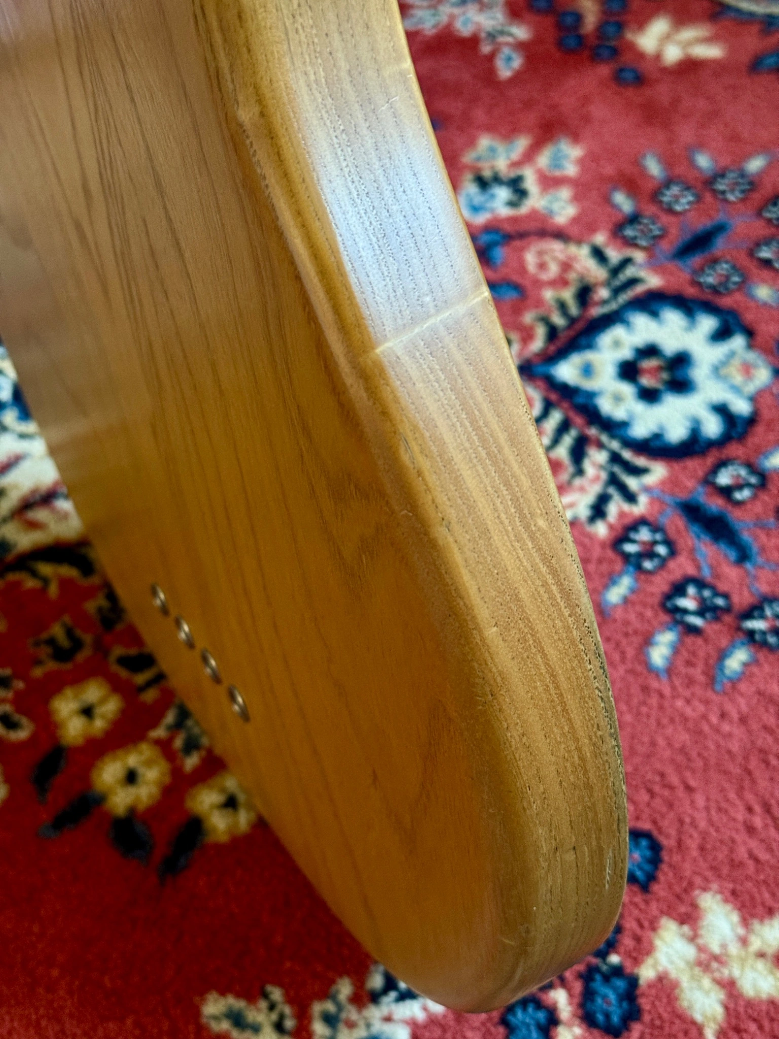Close-up of wear along the body edge and finish.