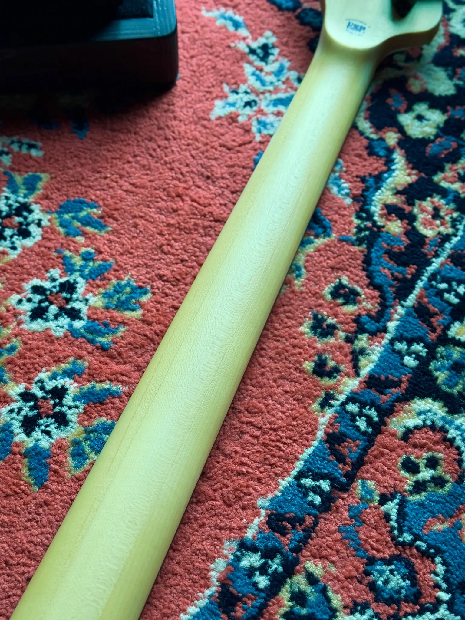 Rear neck finish and body joint