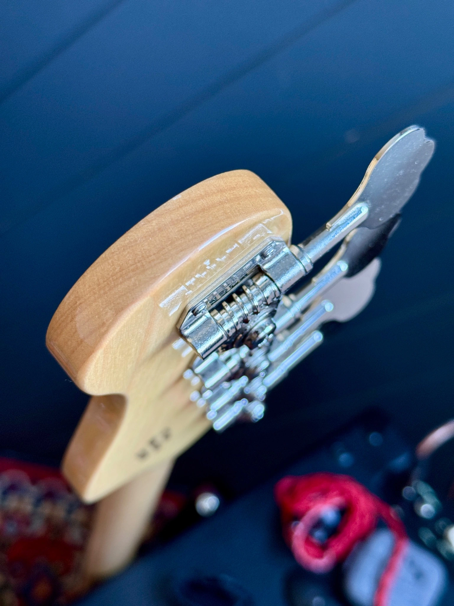 Side view of the headstock and tuner hardware.