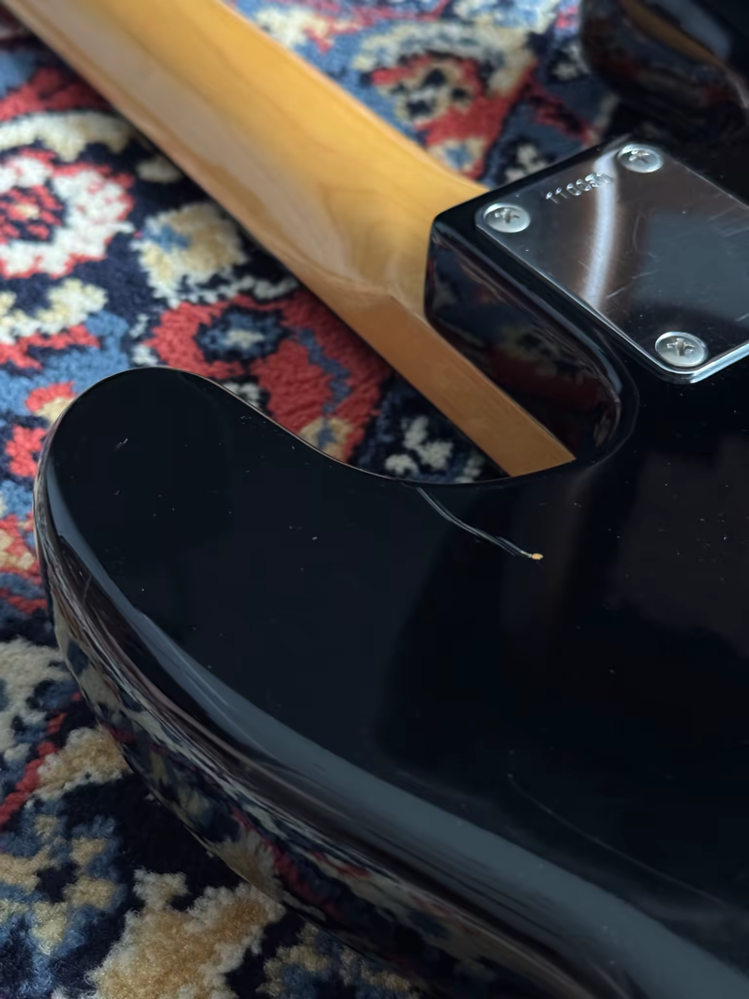 Tokai PB-40 neck plate and small finish chip at the body edge