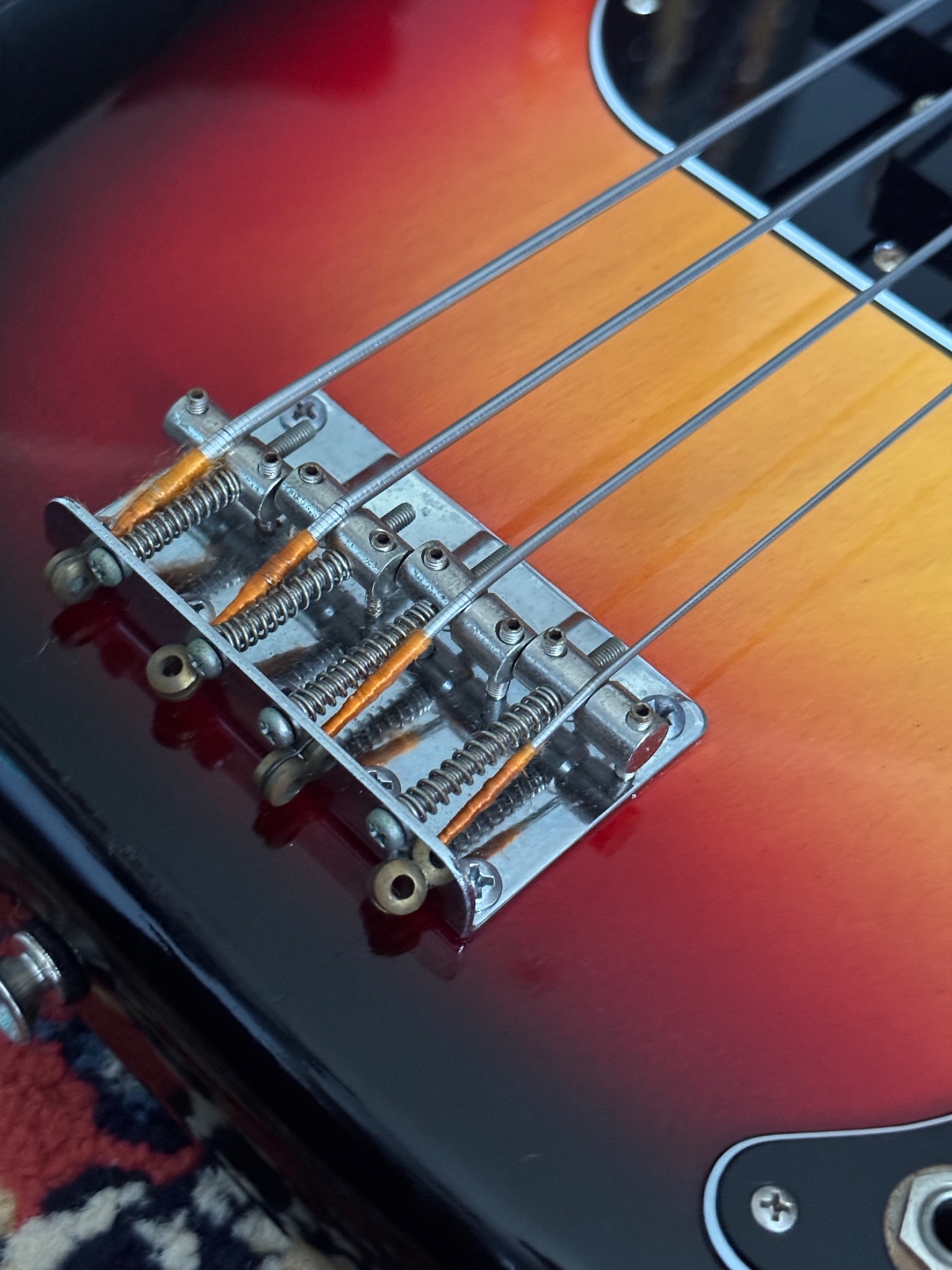 Close view of the bridge and saddle hardware.