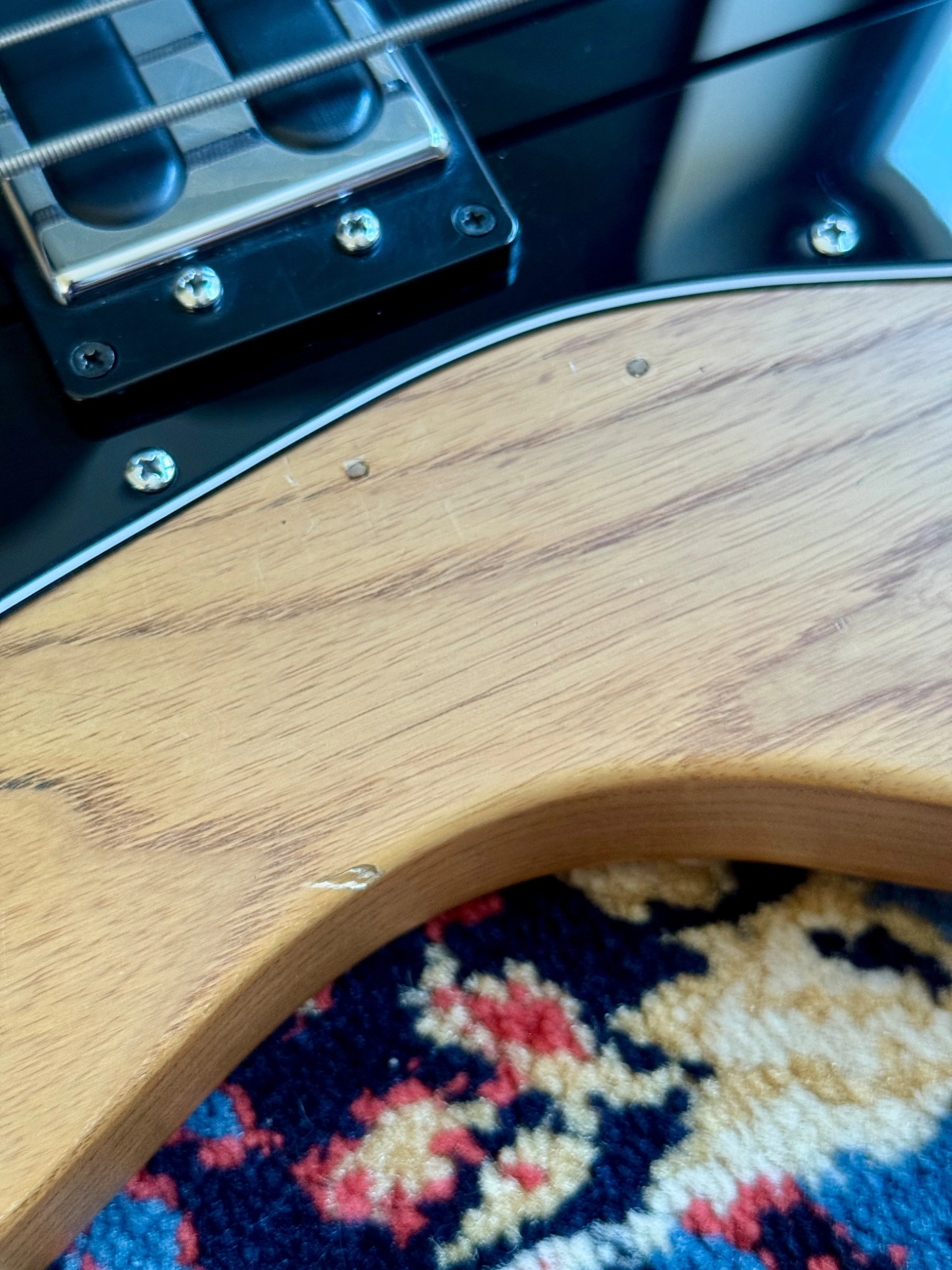 Close-up documenting small surface marks along the body edge.