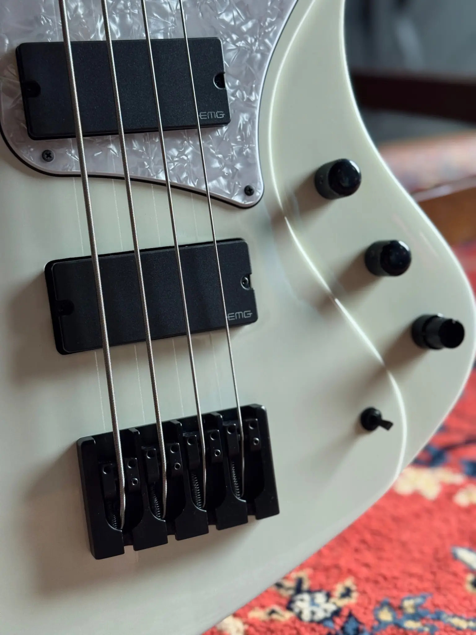 Black EMG pickups, controls and bridge