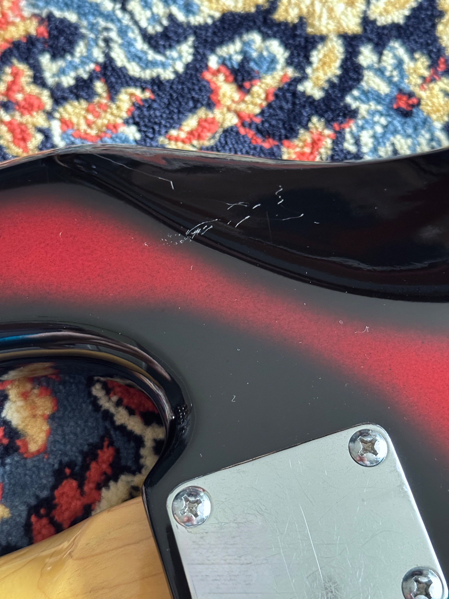 Close view of the finish and neck plate at the body joint.