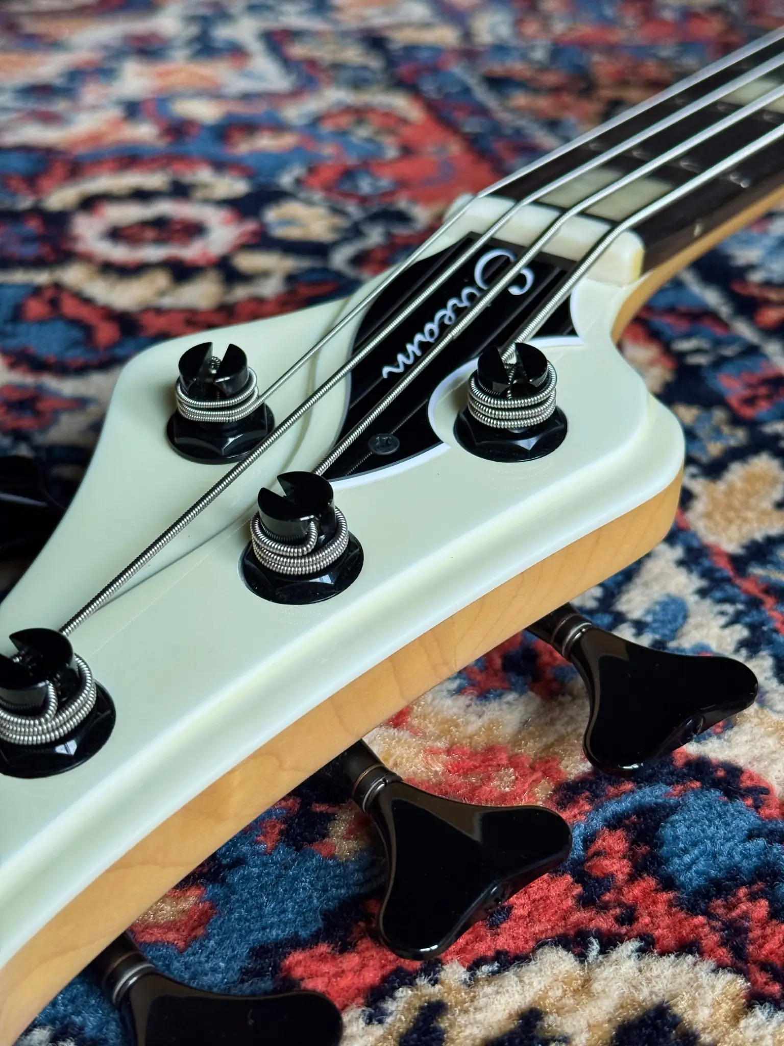 Headstock angle, logo and tuner layout