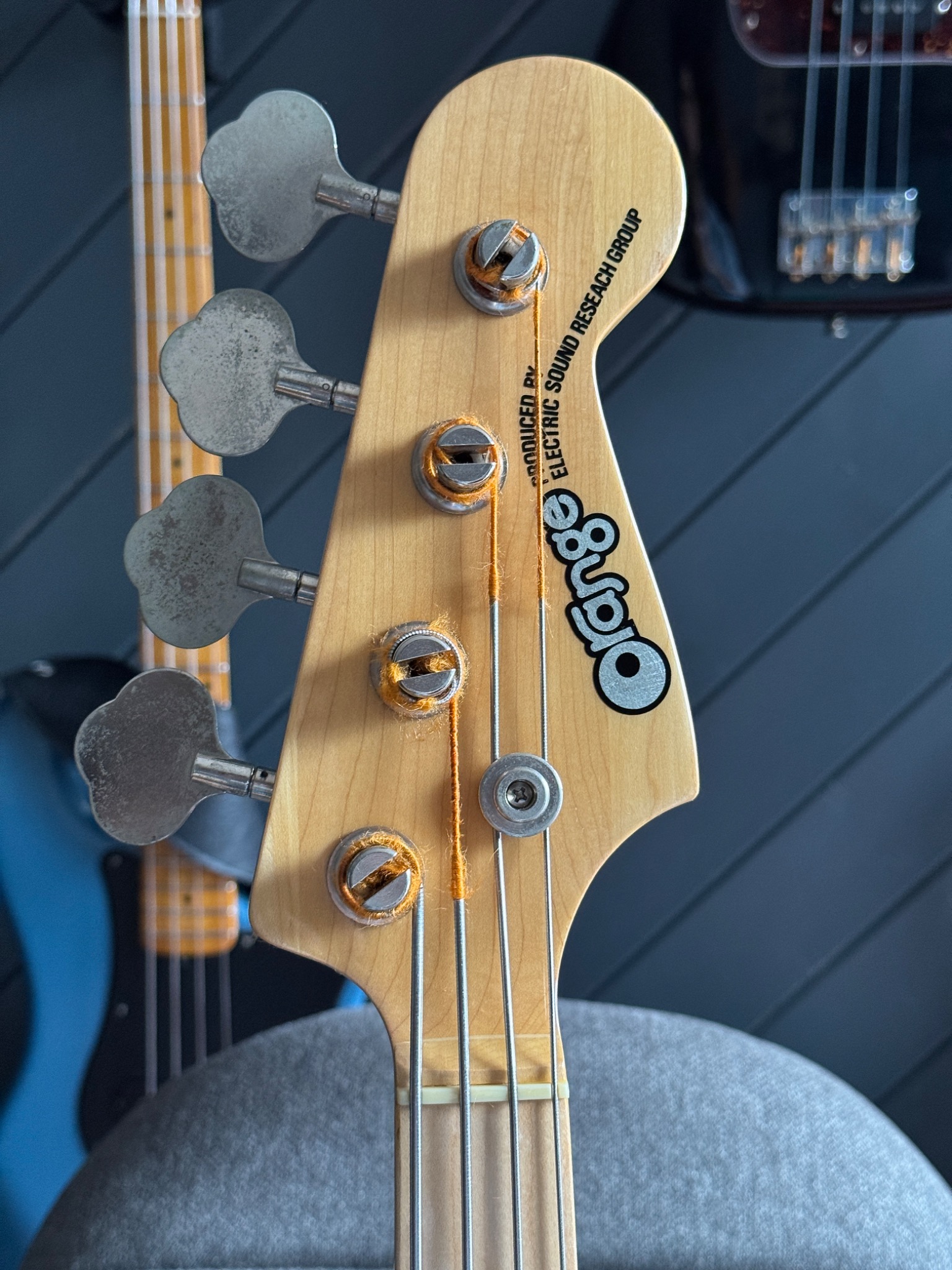 Headstock marking reading Orange and Produced by Electric Sound Research Group.