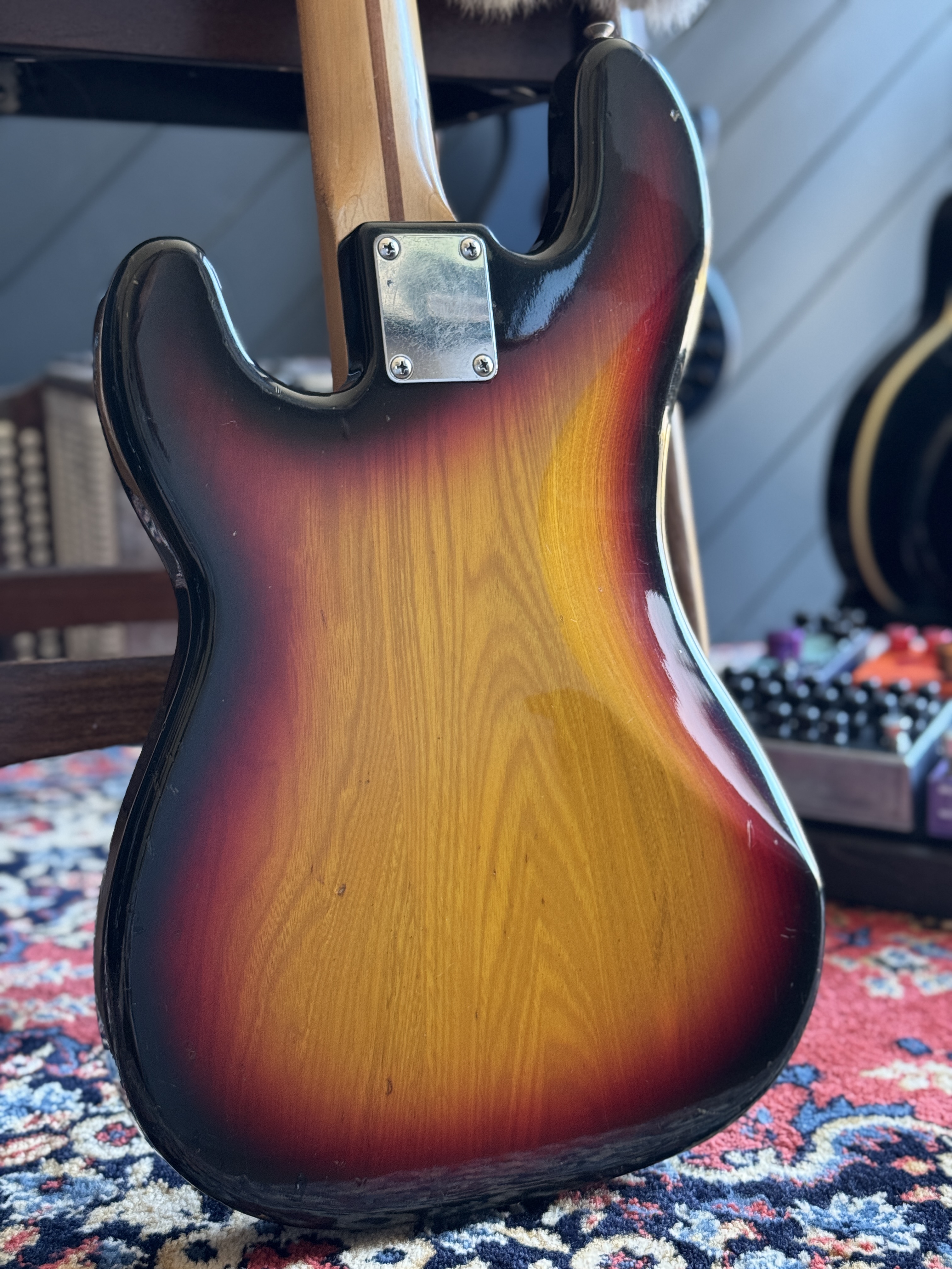 Close front view of the sunburst body, pickups and controls