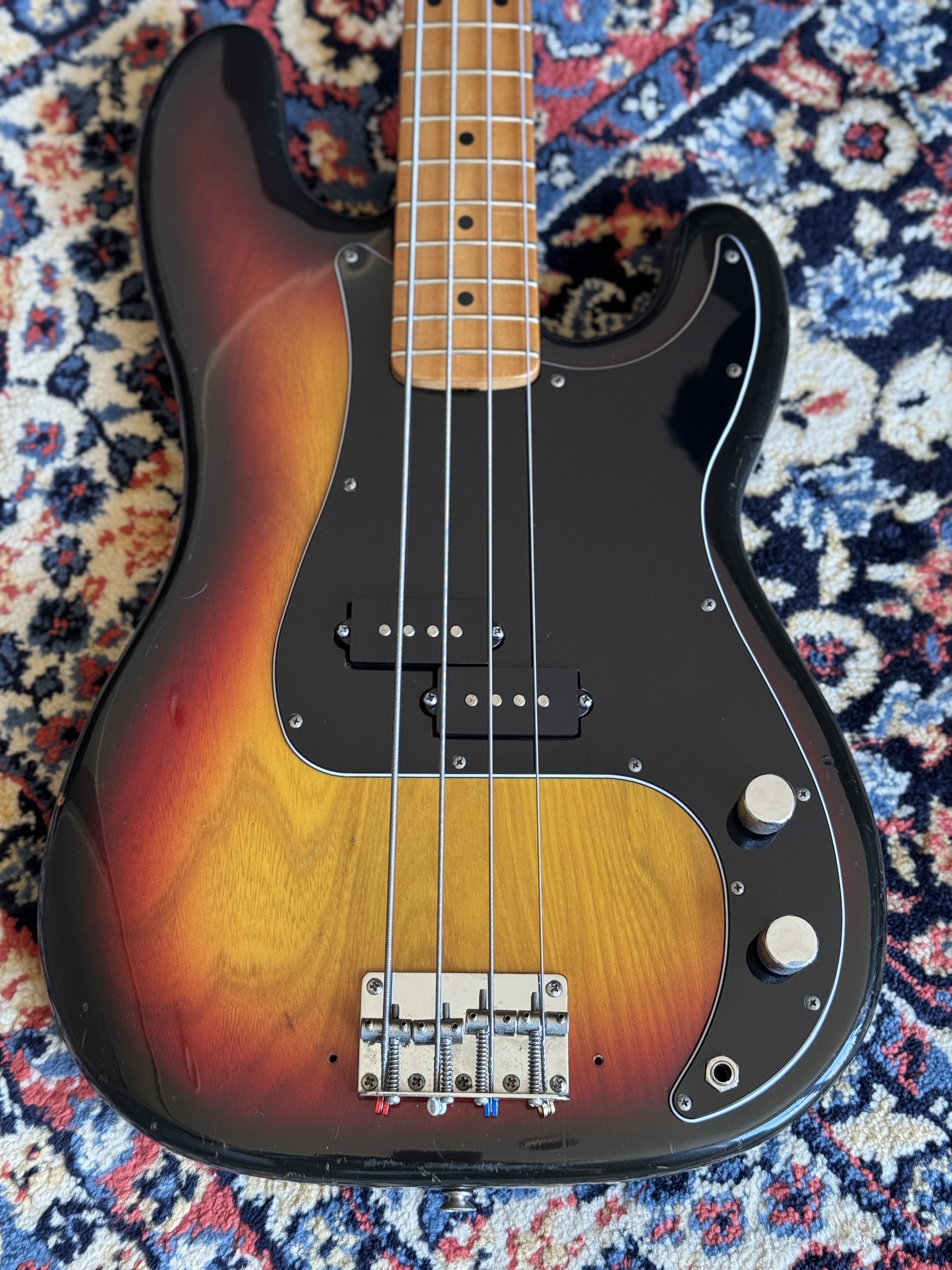 Close rear view of the sunburst body and neck plate