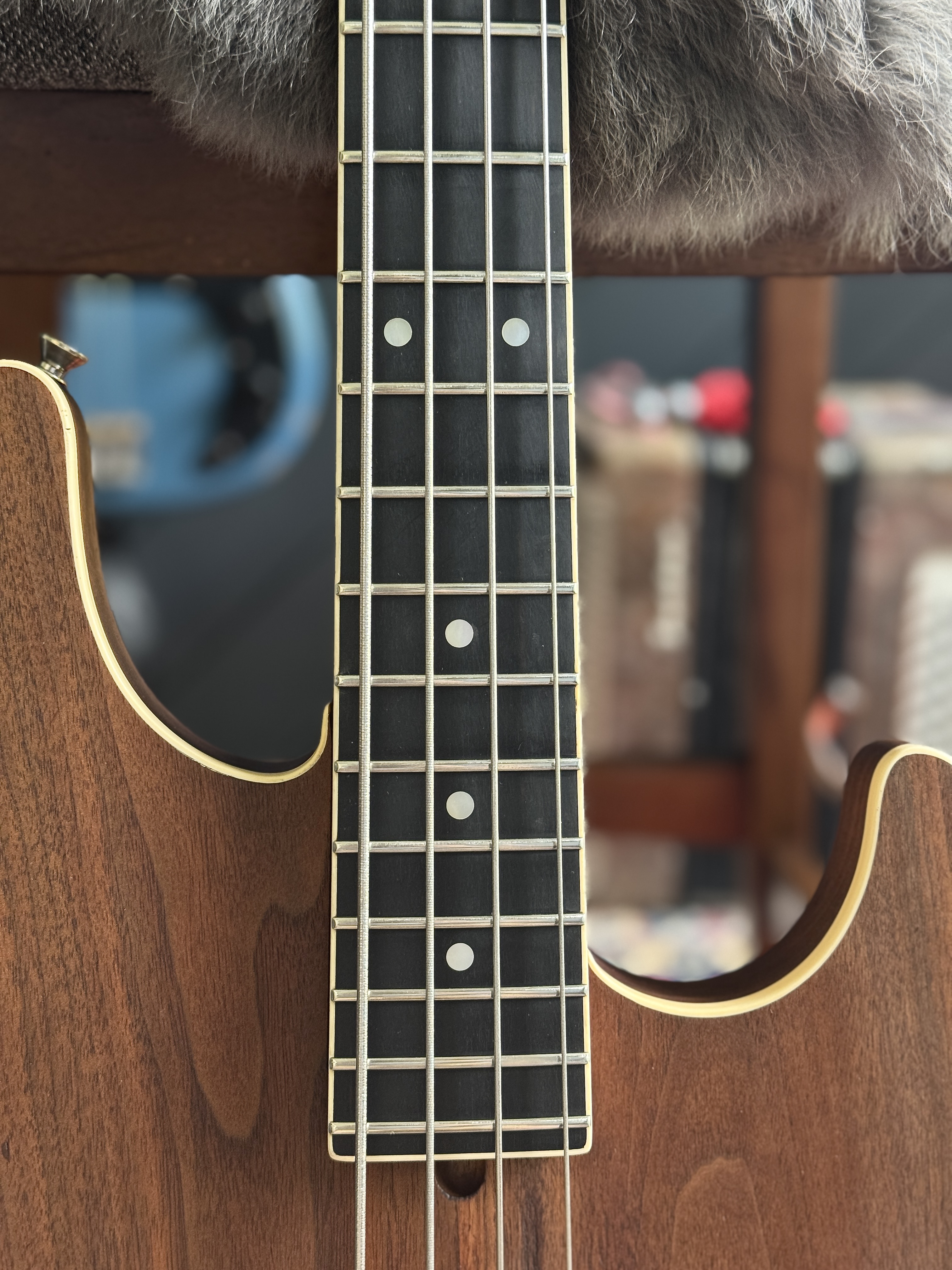 Front of the brown body and lower fingerboard