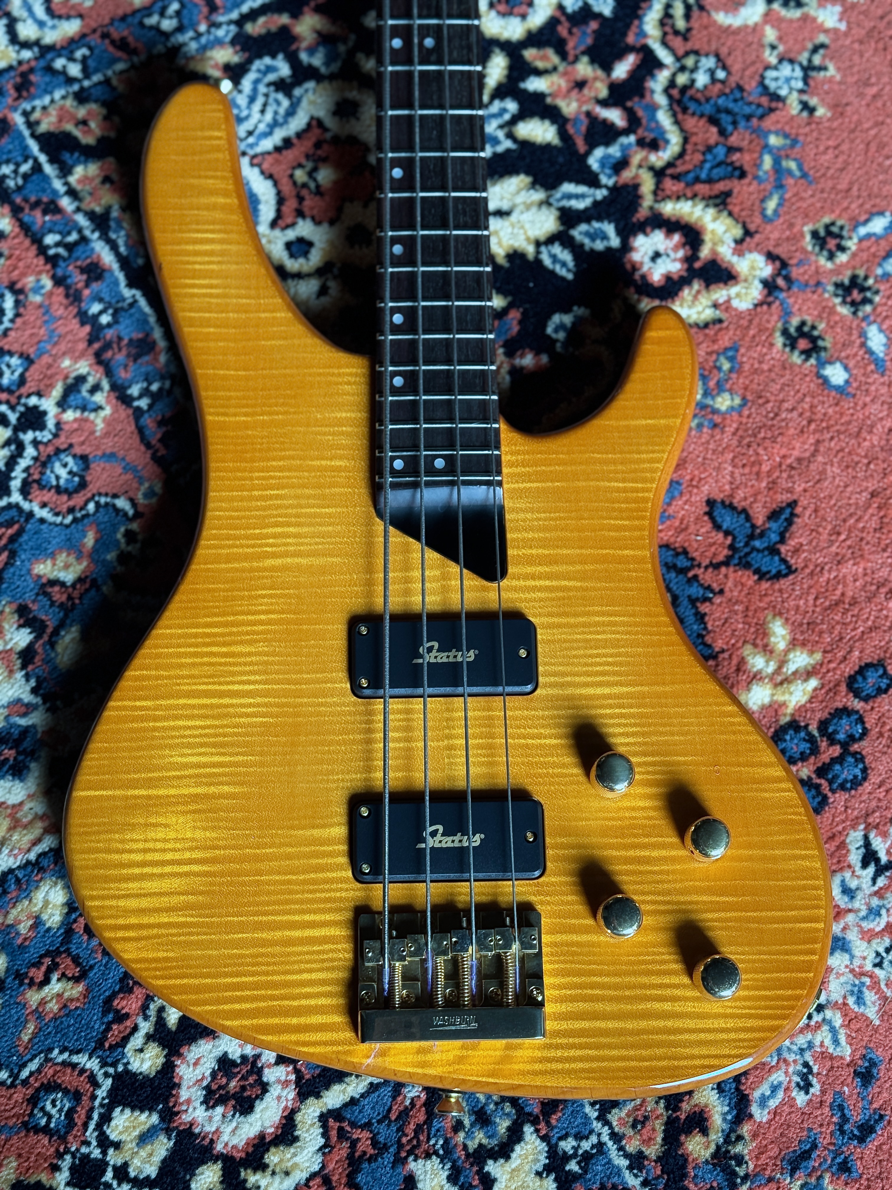 Overhead front view of the flame-maple body, pickups and controls
