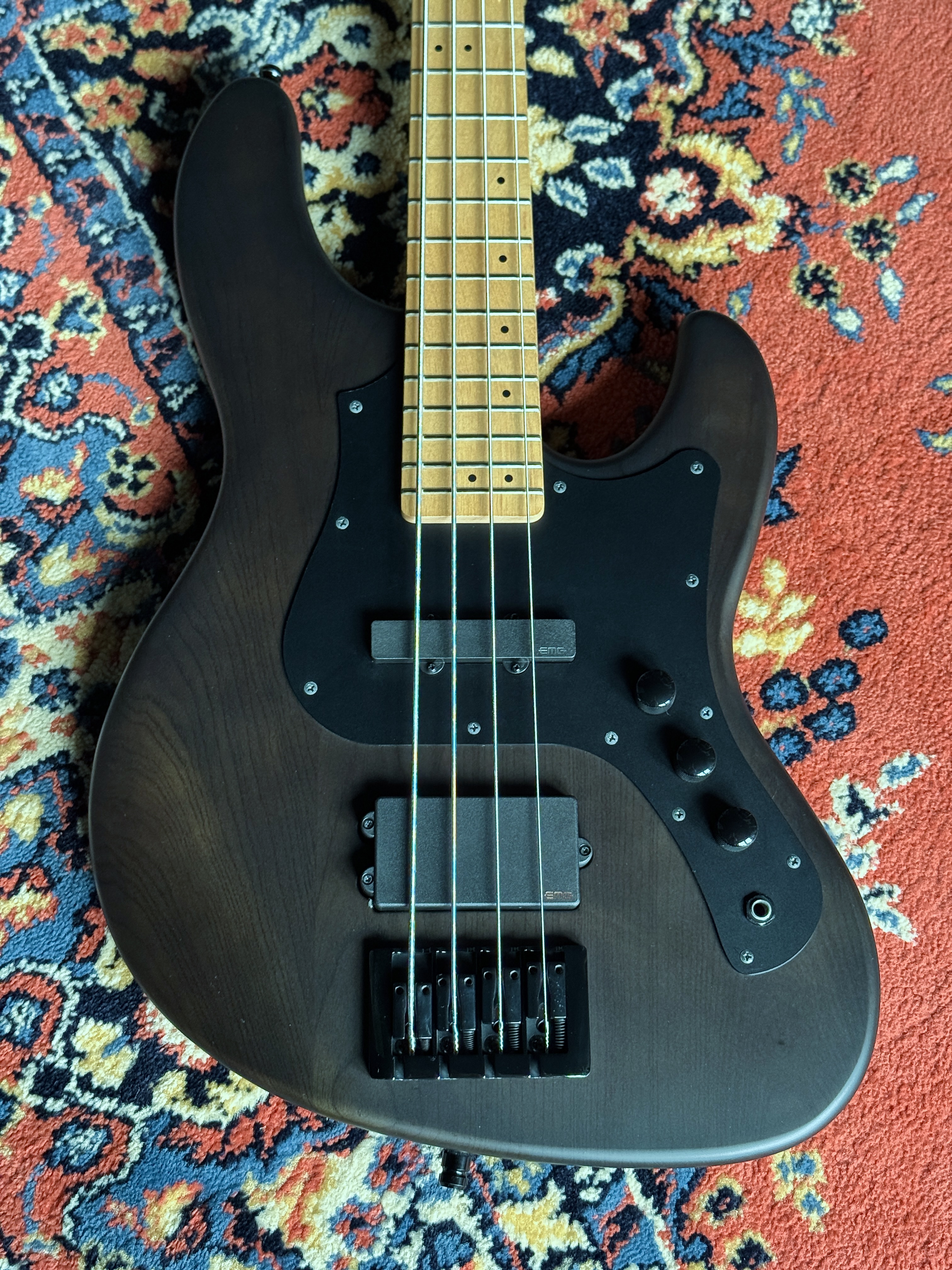 Front view of the bass on a patterned rug