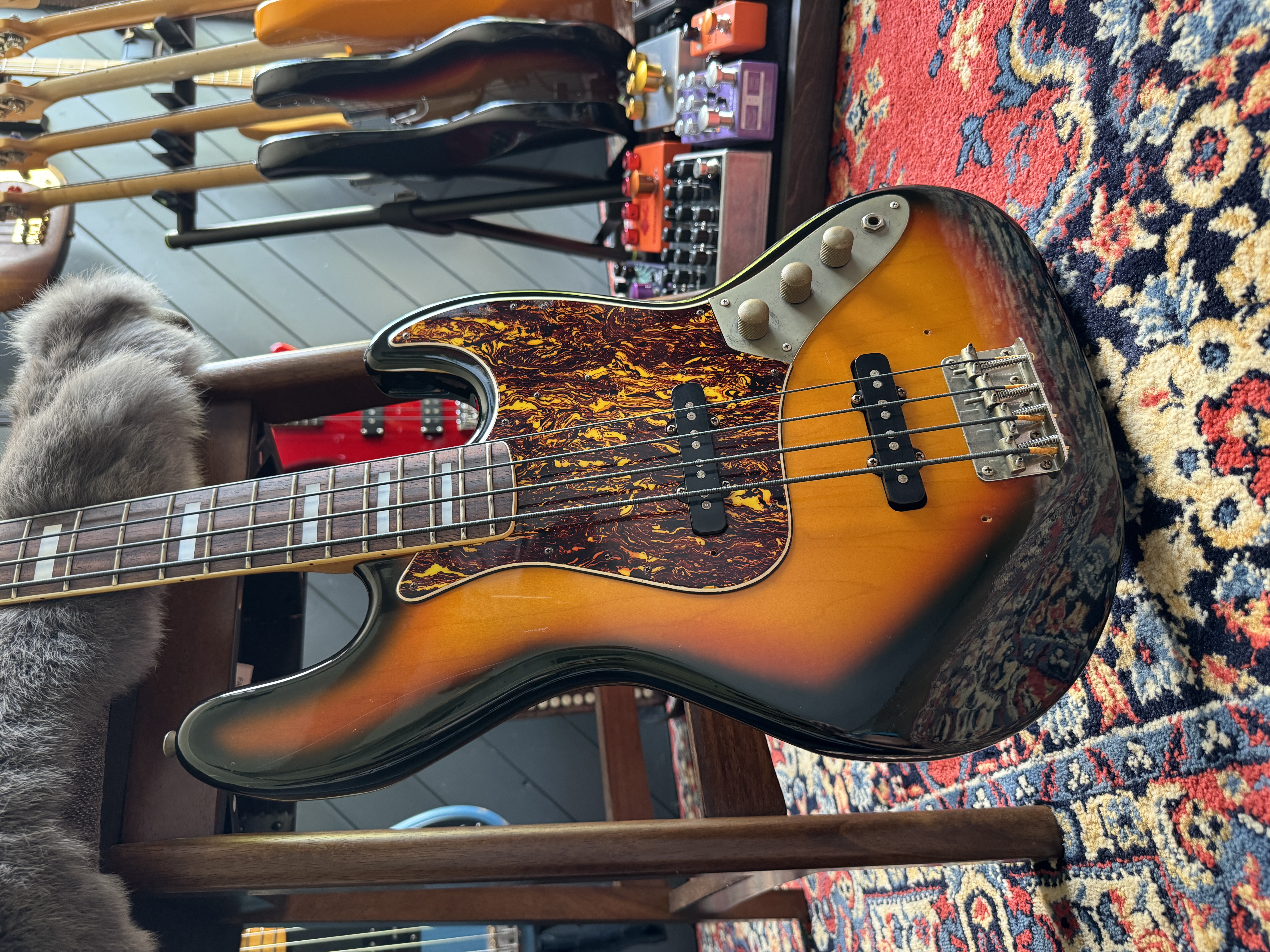Close front view of the sunburst body, pickups and controls